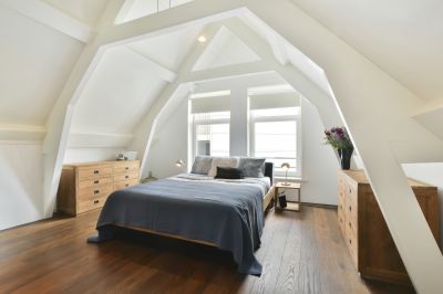 Happy Homeowners in Their New Attic